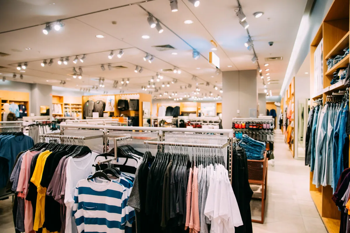 Clothing neatly displayed on shelves in a retail store
