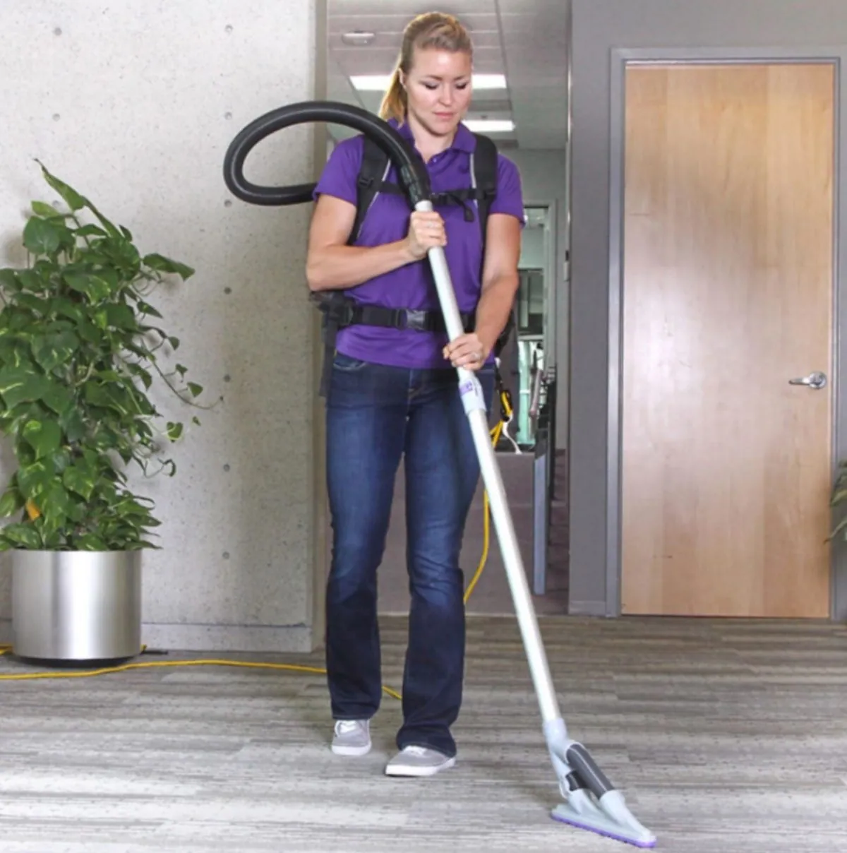 Technician using a backpack vacuum